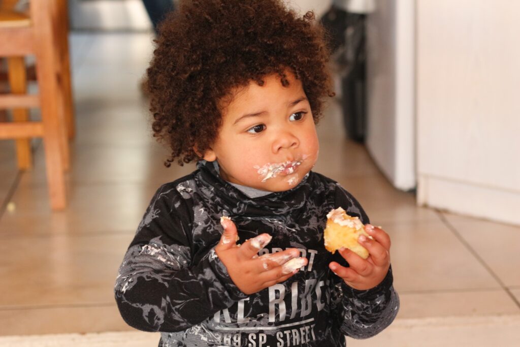kid eating cake
